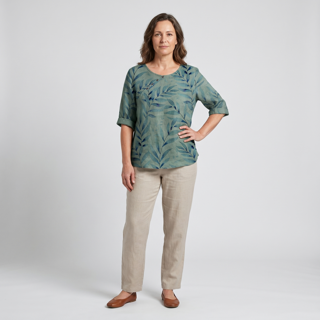 Green patterned asymmetric blouse for women, button details, relaxed casual fit.