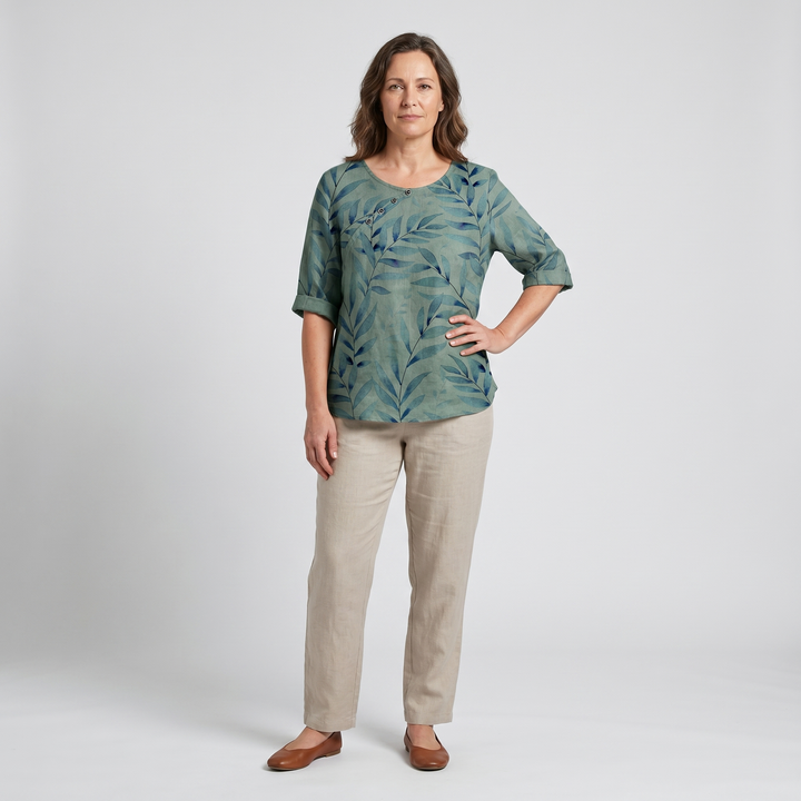 Green patterned asymmetric blouse for women, button details, relaxed casual fit.
