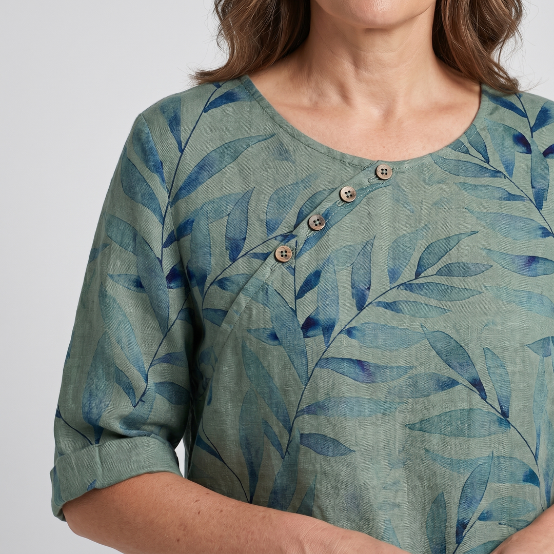 Stylish women's flowy asymmetric blouse, vibrant print, a chic casual fashion statement.