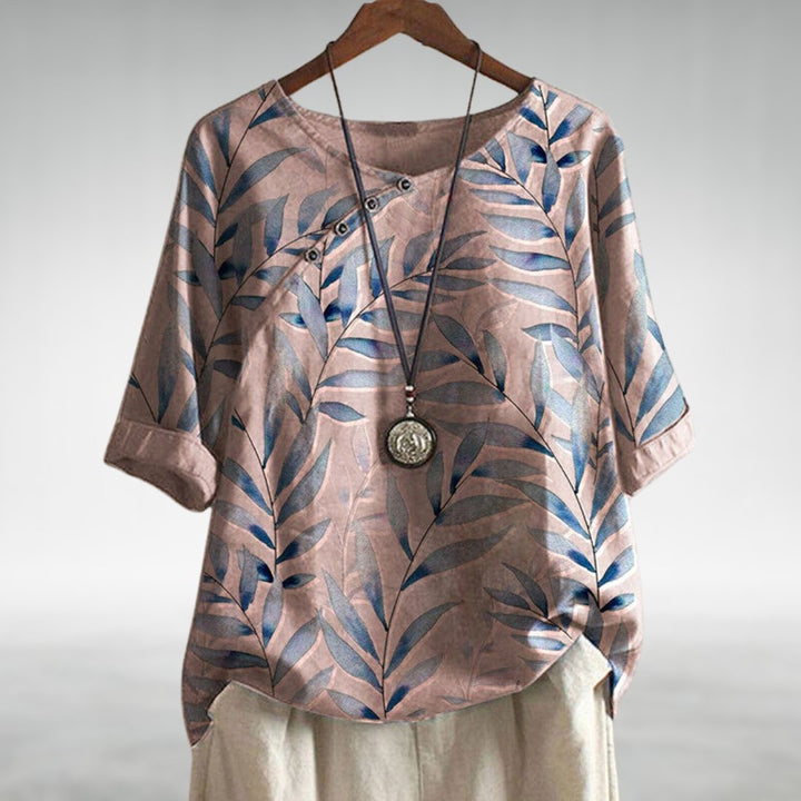 Casual chic women's asymmetric blouse, colorful print, offering comfortable everyday style.