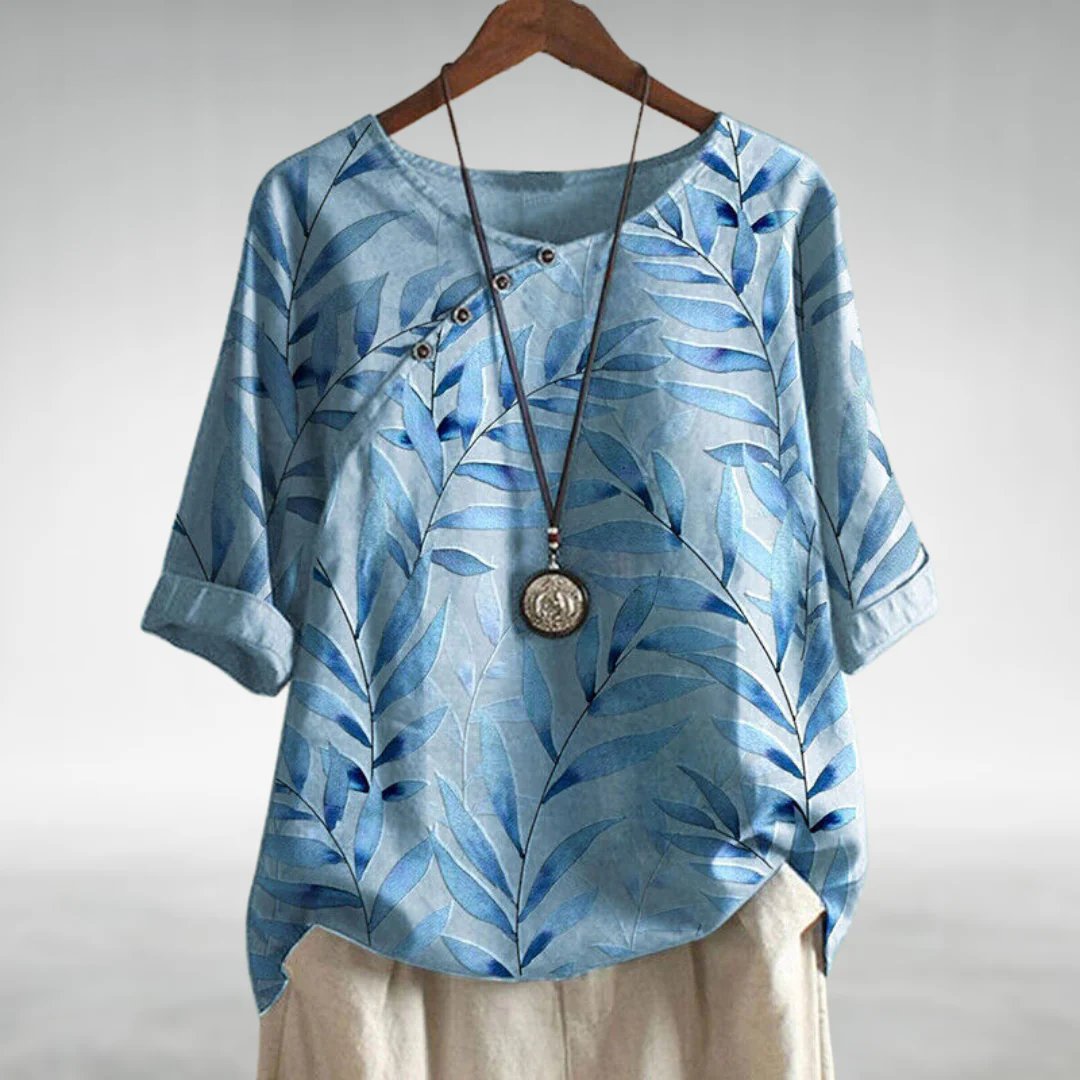 Vibrant women's asymmetric blouse, featuring green, blue, pink, white patterns, a versatile casual top.