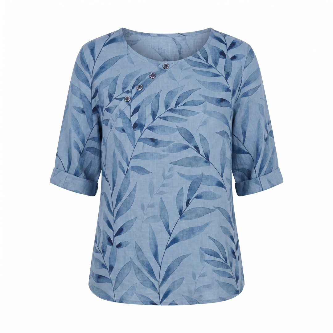 Modern women's asymmetric cut blouse, colorful all-over print, button accents, stylish & flowy.