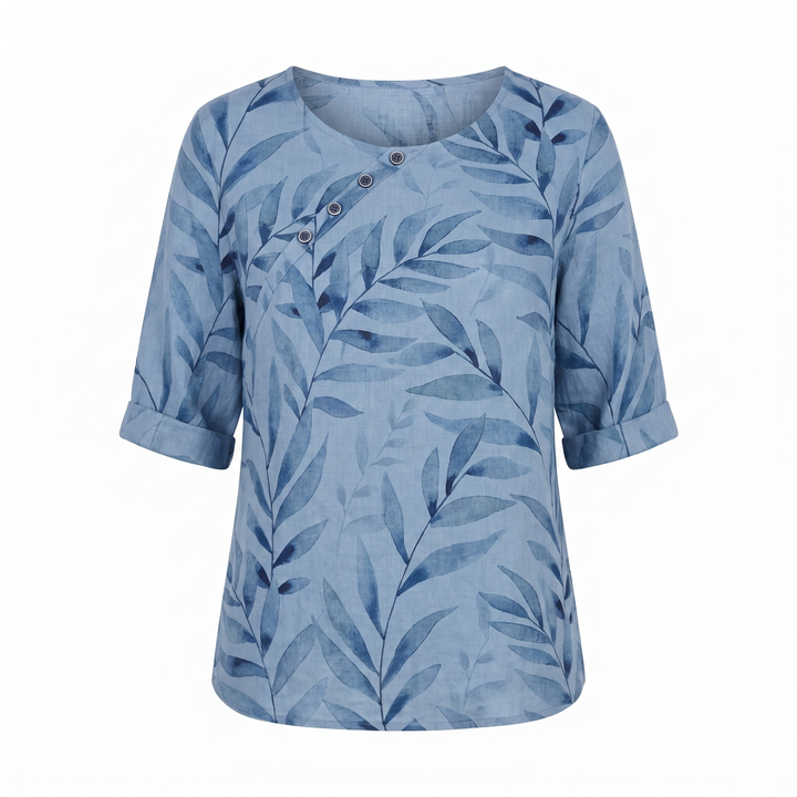 Modern women's asymmetric cut blouse, colorful all-over print, button accents, stylish & flowy.