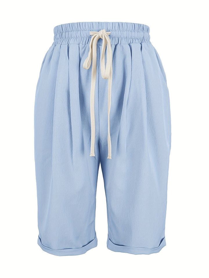 Woman wearing comfortable pull-on cropped straight leg shorts, ideal for everyday summer fashion.