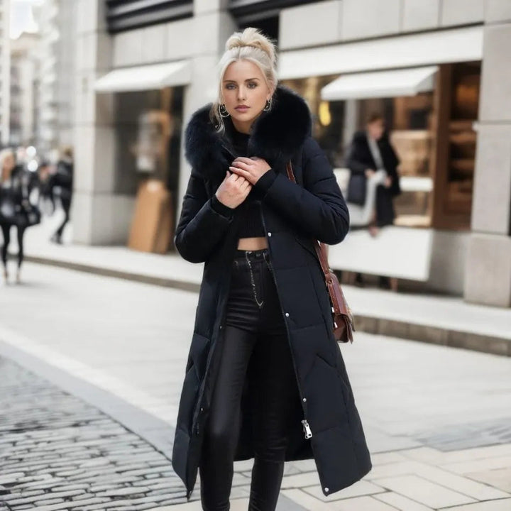Side profile of a women's quilted winter coat, highlighting the elegant trim on the hood
