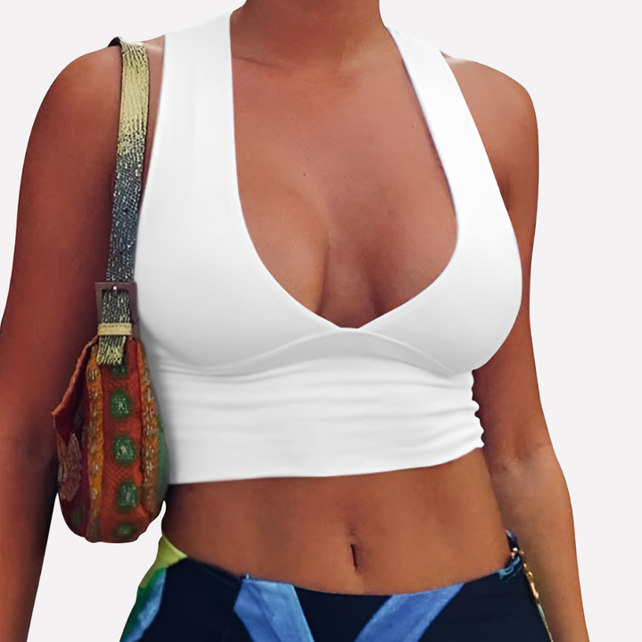 Versatile women's fitted crop top, deep V-neck, racerback design with cutouts. Casual summer fashion, trendy.