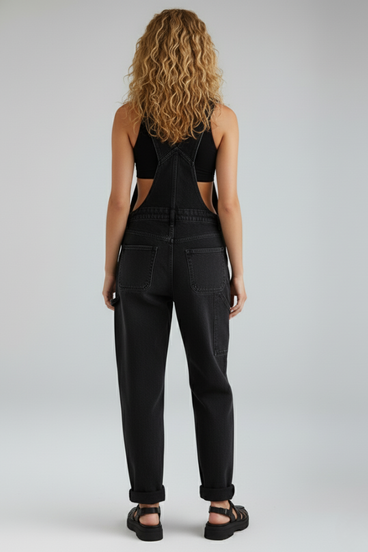 Comfortable all-season black women's jumpsuit with a loose fit, round neck, straight leg, and useful pockets.