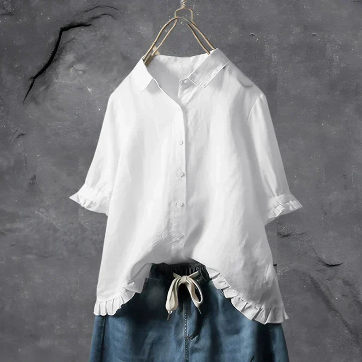 Women's relaxed fit button-down shirt with elegant ruffle trim. Perfect short-sleeve casual top for summer.