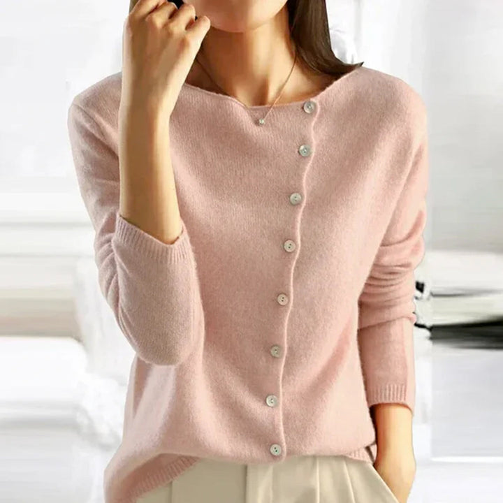 Women's relaxed fit button-front cardigan in a cozy knit, perfect for winter layering fashion.