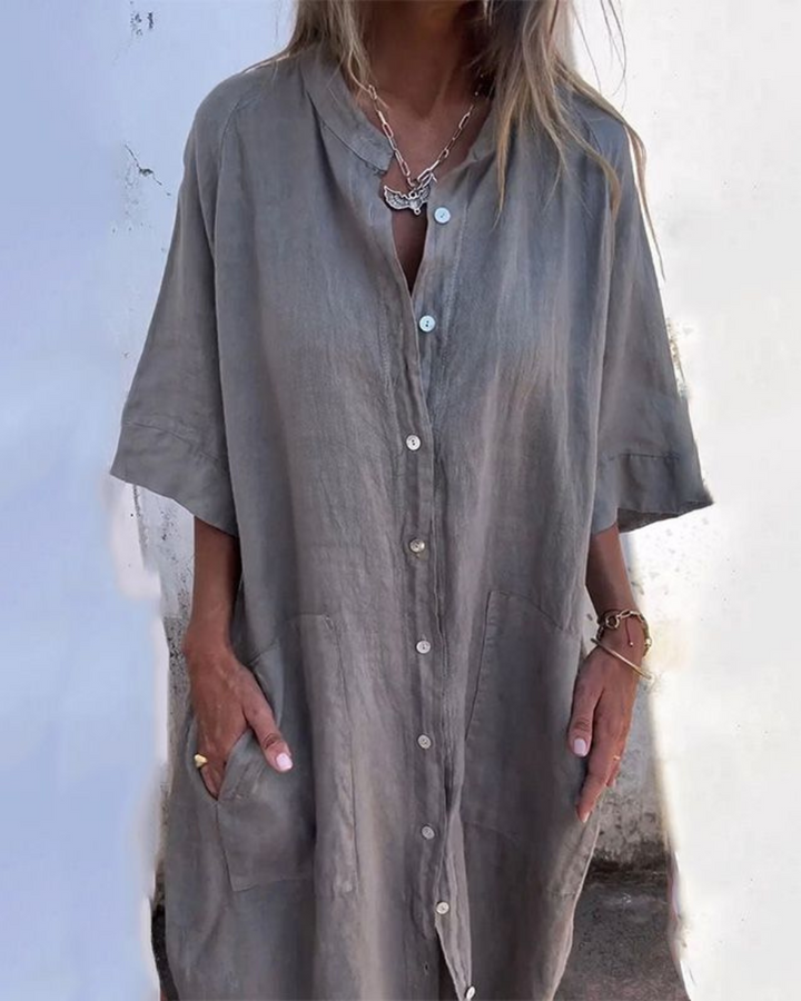 Women's relaxed fit button-front shirt dress with pockets, perfect for casual summer wear.