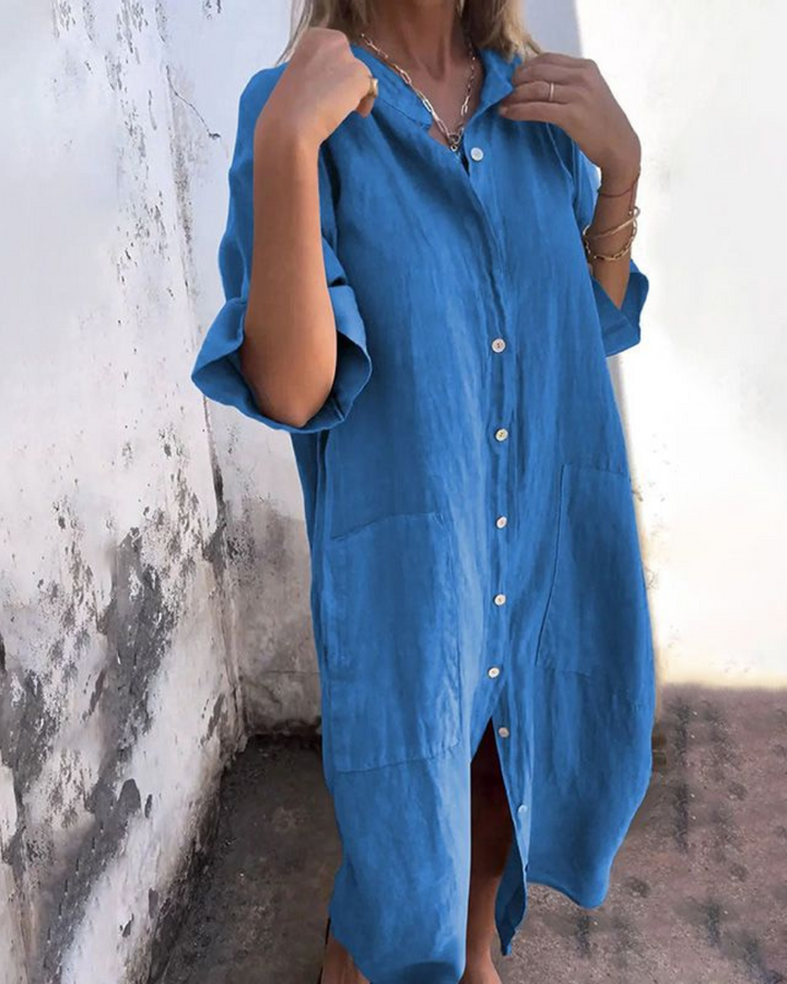 Versatile women's button-front shirt dress with a relaxed fit, featuring convenient pockets & a stylish V-neck.