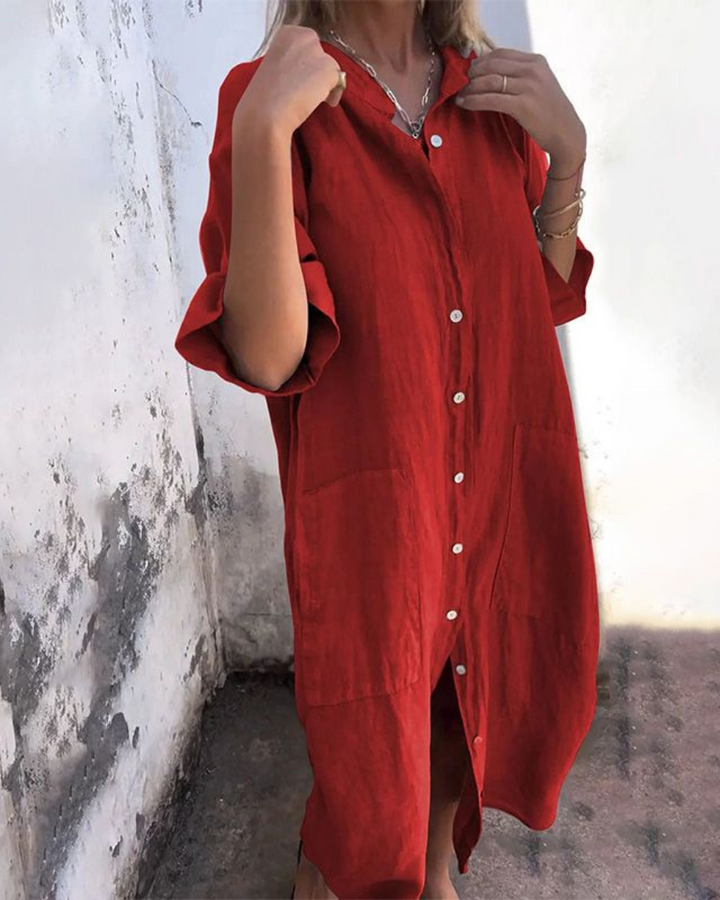 Stylish women's button-front shirt dress, comfortable relaxed fit with short sleeves, V-neck, and convenient pockets.