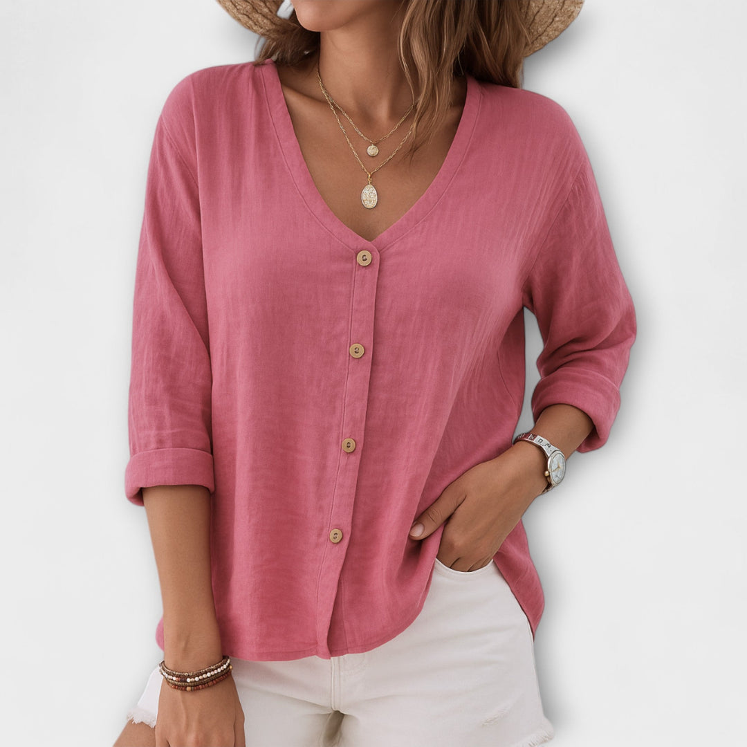 Effortless style: Chic women's relaxed button-up blouse. Comfortable long sleeve V-neck, versatile ladies fashion.