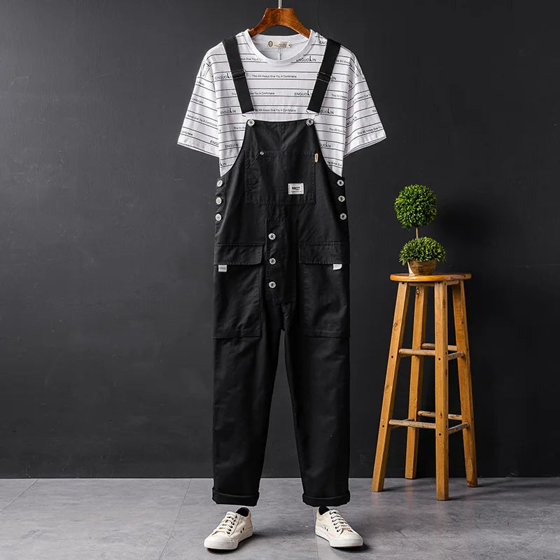 Blue denim women's relaxed fit bib overalls. Comfortable sleeveless jumpsuit for casual spring & summer style.