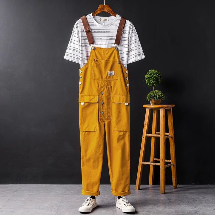 Classic women's denim bib overalls. Relaxed fit full-length jumpsuit, perfect for casual spring and summer style.