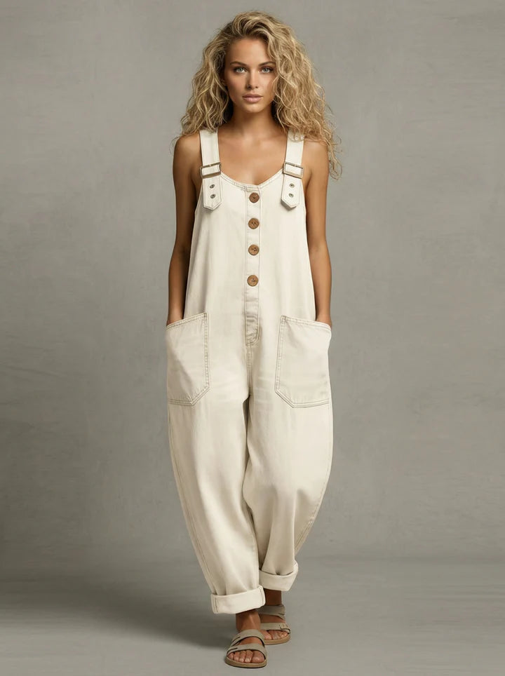 Casual women's denim overalls with multiple pockets and a convenient button-front design, offering comfortable one-piece styling.