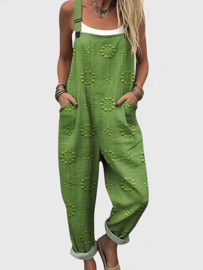 Comfortable women's relaxed fit jumpsuit, featuring delicate floral embroidery, adjustable straps & convenient pockets.
