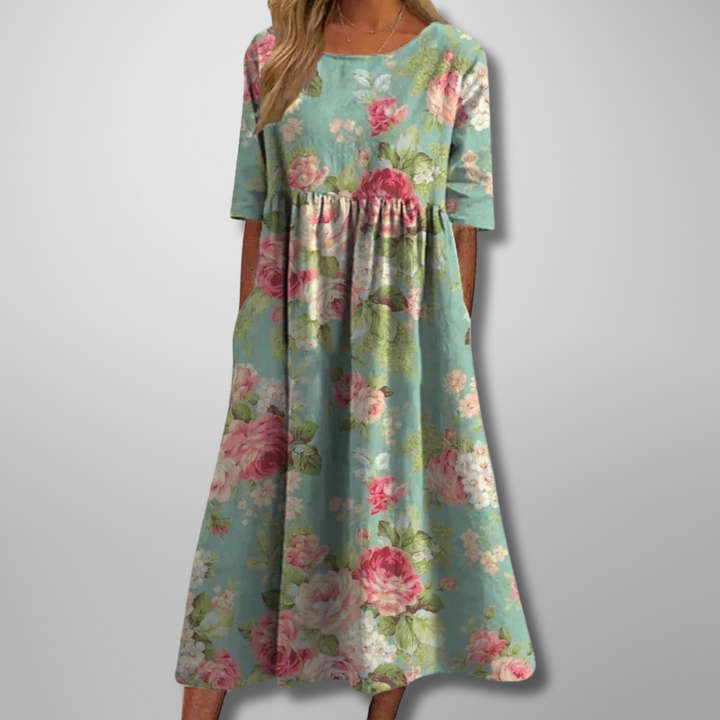 Elegant women's flowy floral midi dress with a relaxed fit, ideal for versatile summer fashion.