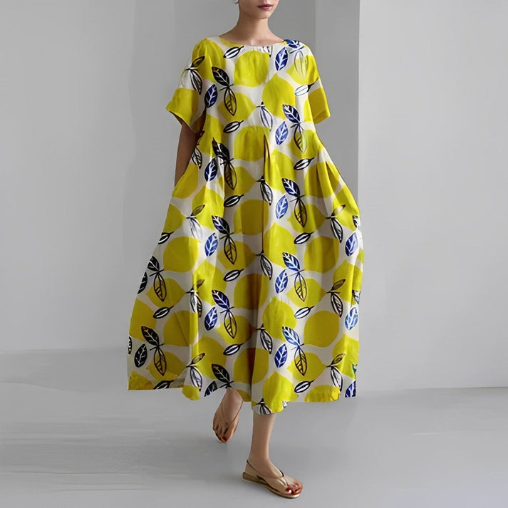 A vibrant women's relaxed floral midi dress, showcasing a beautiful print, suitable for warm weather.