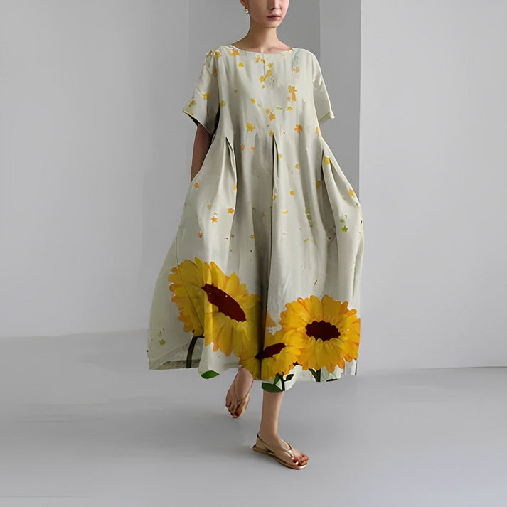 Flowy women's casual midi dress with a colorful floral print, offering a relaxed and comfortable fit.