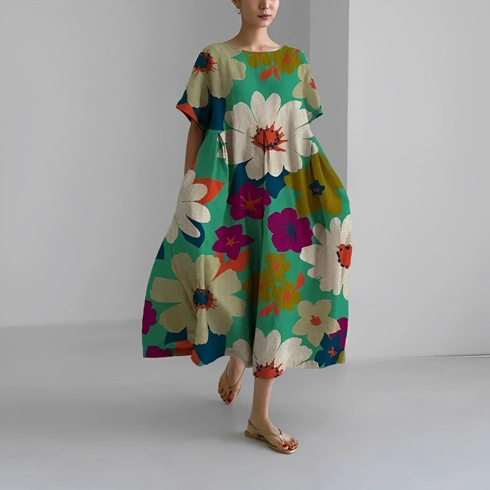 Close-up of the floral print on a women's relaxed fit midi dress, highlighting intricate details.