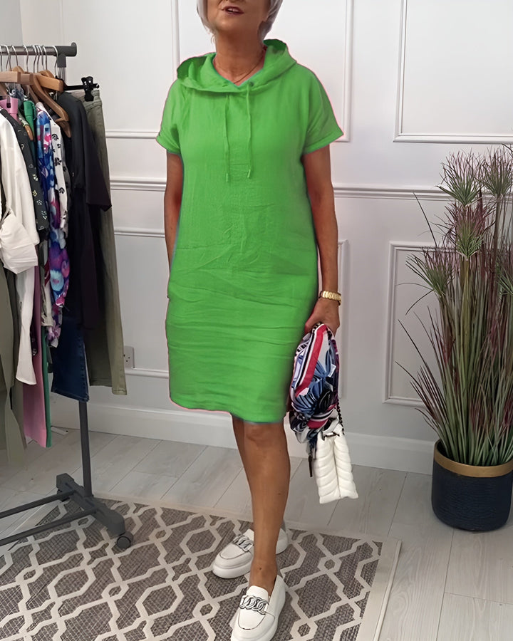 Everyday comfort in a women's relaxed fit hoodie midi dress featuring an adjustable hood.