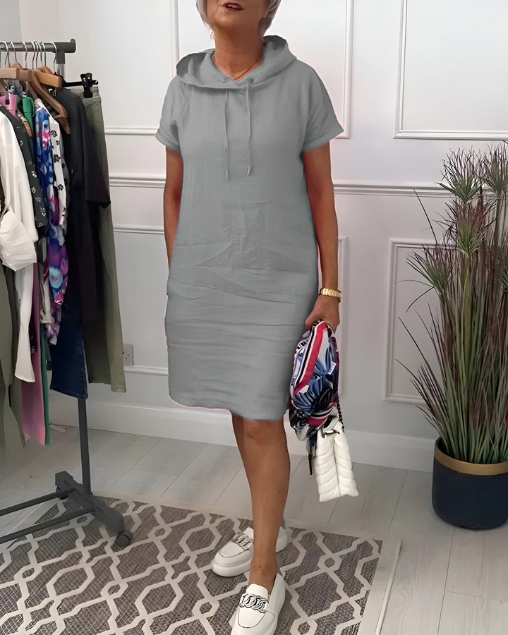 Stylish women's midi hoodie dress, relaxed fit, half sleeve design, and adjustable hood for comfort.