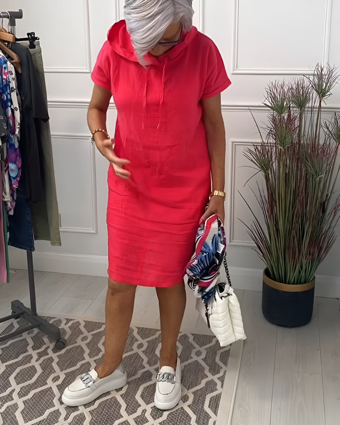 Casual women's summer hoodie midi dress; relaxed fit for everyday comfort, with an adjustable hood.