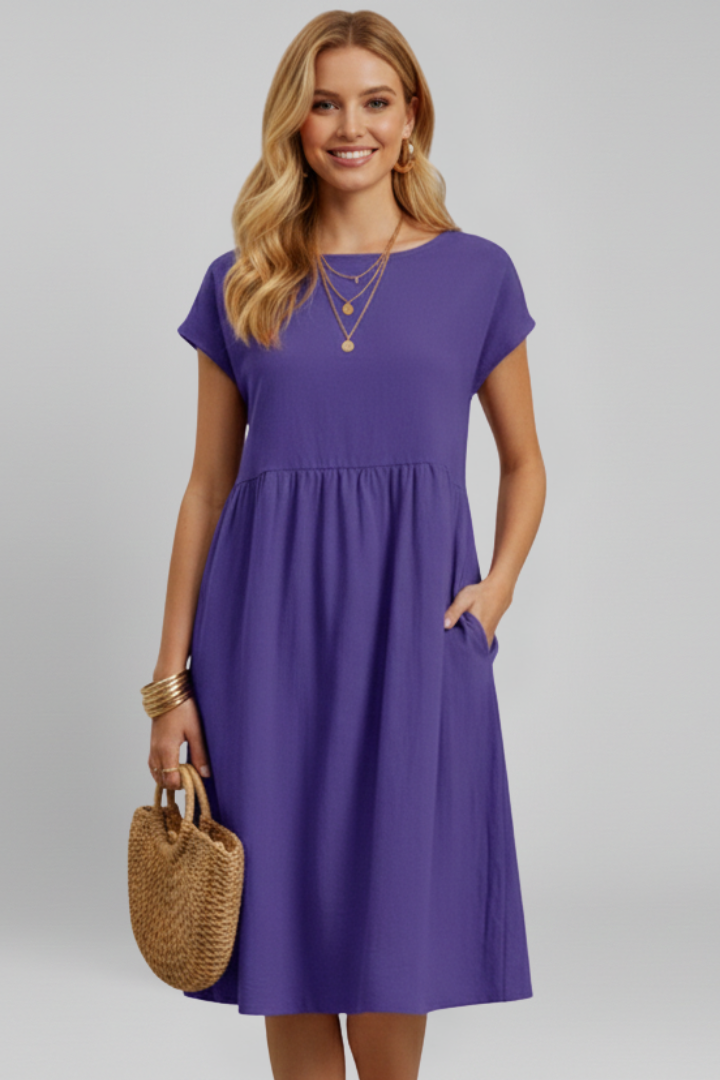 Women's short sleeve knee-length dress, relaxed fit, pockets included, great for casual spring outfits.