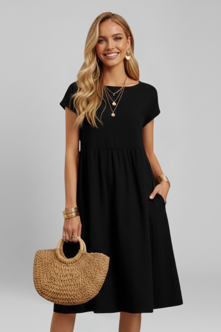 Comfortable women's knee-length relaxed fit dress with pockets, perfect for casual summer days.