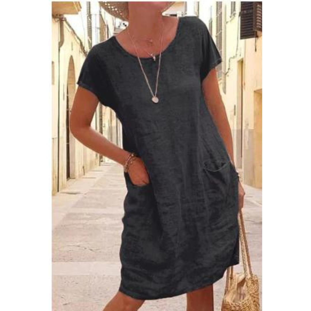 Comfortable women's relaxed fit knee-length t-shirt dress with pockets, ideal for everyday casual style.
