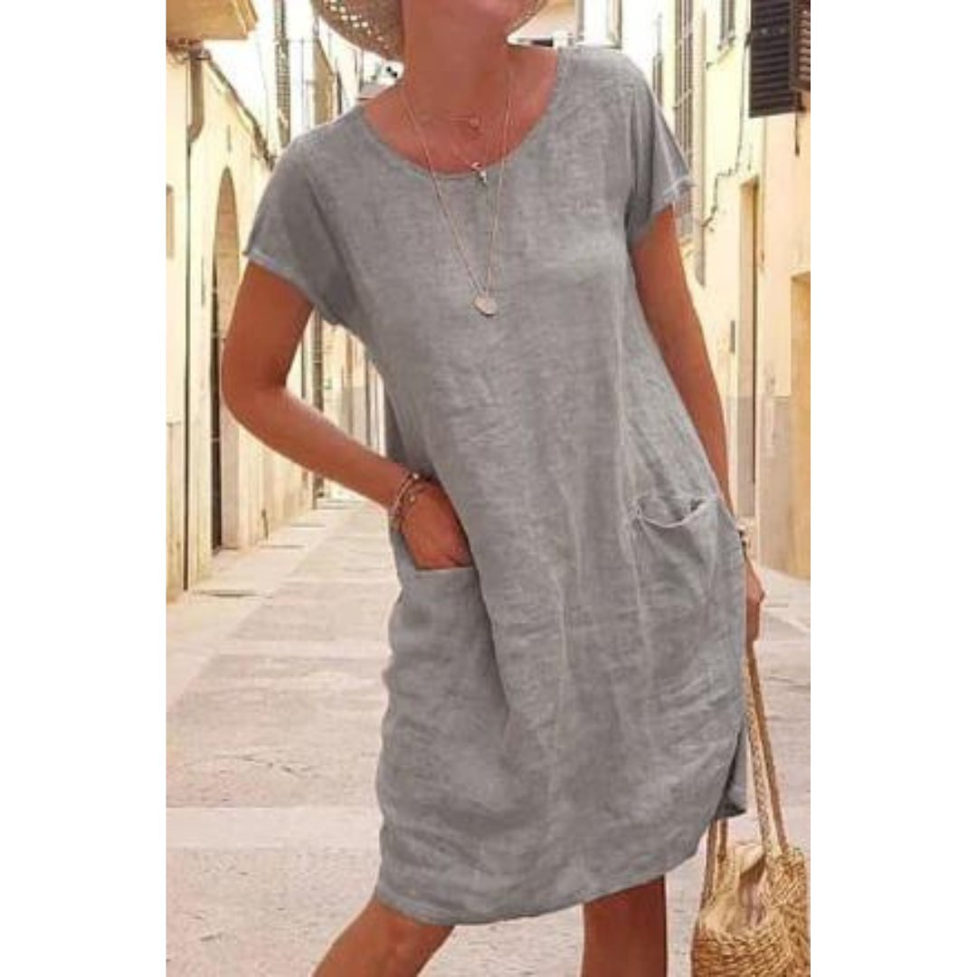 Stylish women's relaxed fit t-shirt dress, knee-length with short sleeves, offering effortless comfort.