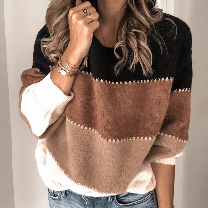 Versatile women's knit top, a relaxed fit crew neck pullover sweater with ribbed cuffs for casual style.