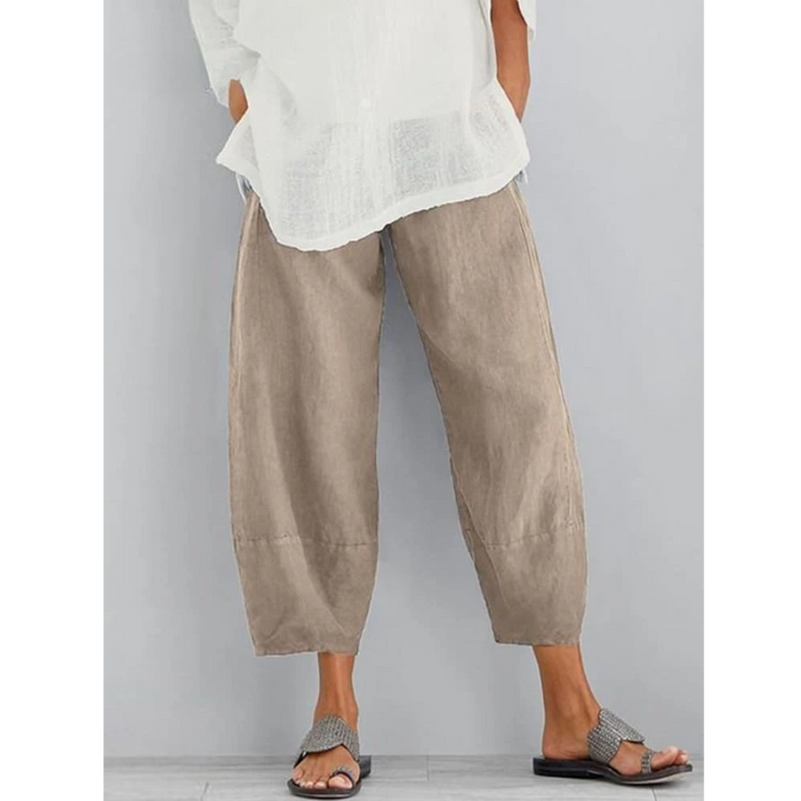 Model wearing comfortable women's relaxed fit linen pants for a chic, casual everyday look.