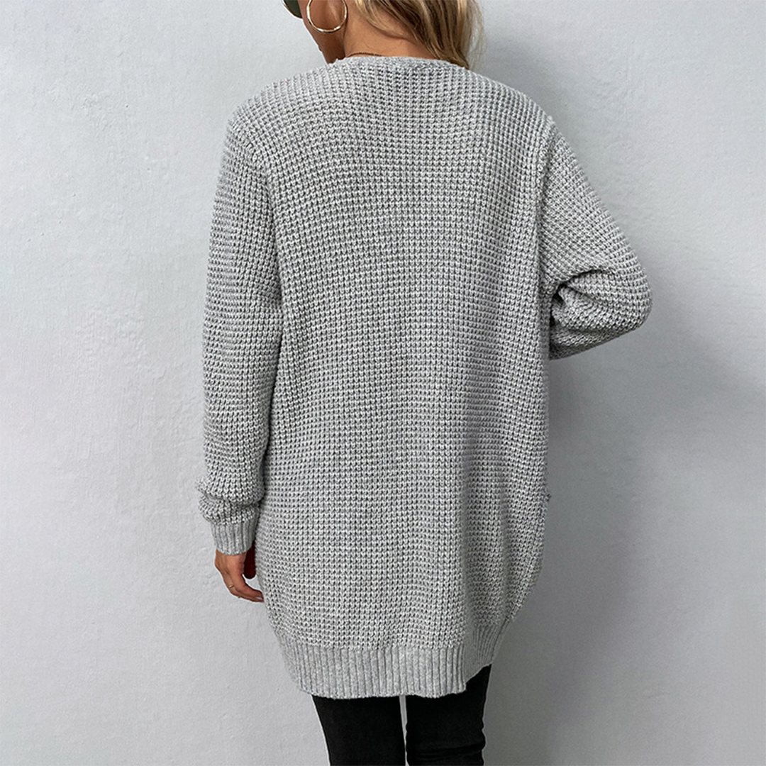Stylish women's winter cardigan with a relaxed fit, long sleeves, and practical pockets.