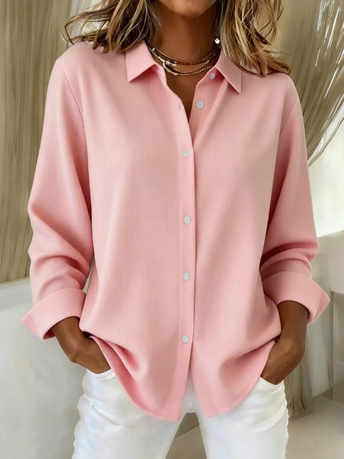 Professional women's long sleeve button down blouse. Relaxed fit, ideal for comfortable office wear.