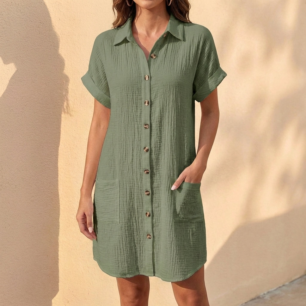 Women's relaxed fit midi shirt dress with button-front, collared neckline, & cuffed sleeves. Versatile for summer.