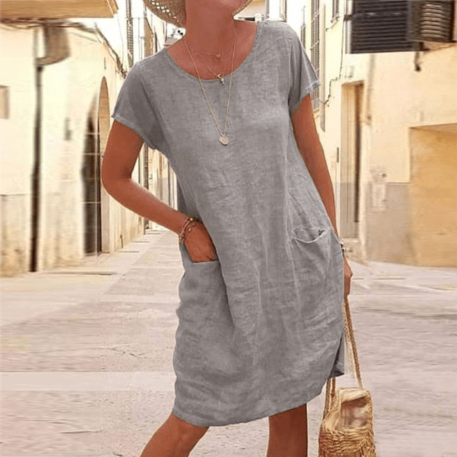 Comfortable women's short sleeve mini dress. Relaxed fit design with pockets, ideal for daily fashion & summer.