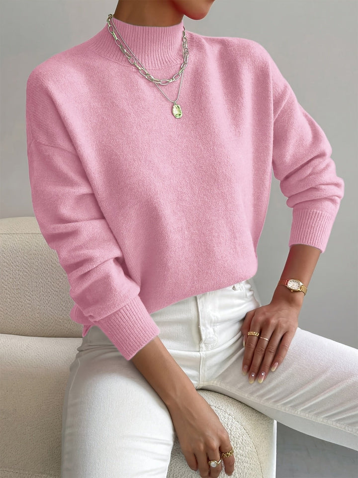 Comfortable ladies' relaxed fit long sleeve mock turtleneck sweater, ideal for cozy winter fashion.