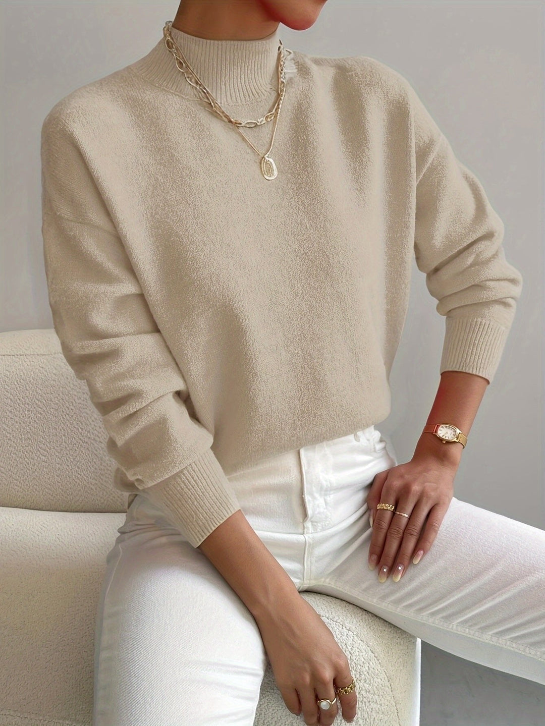 Soft knit women's relaxed fit mock turtleneck long sleeve sweater, comfortable and stylish for daily wear.