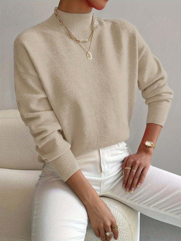 Soft knit women's relaxed fit mock turtleneck long sleeve sweater, comfortable and stylish for daily wear.