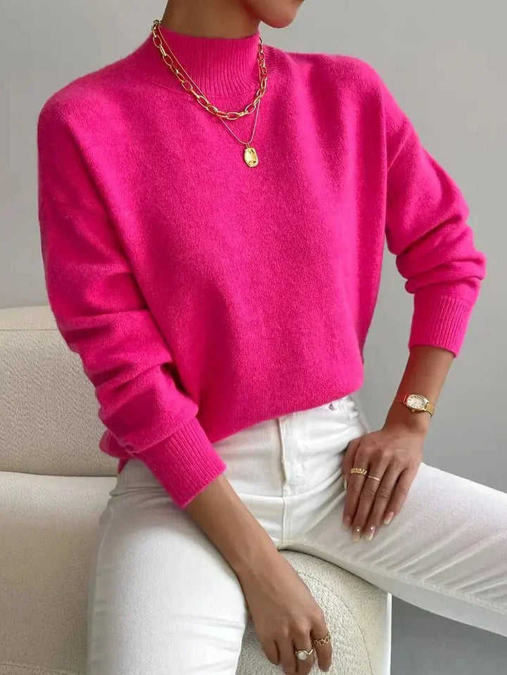 Elegant relaxed fit women's mock turtleneck sweater, long sleeves, ideal for layering in cooler seasons.