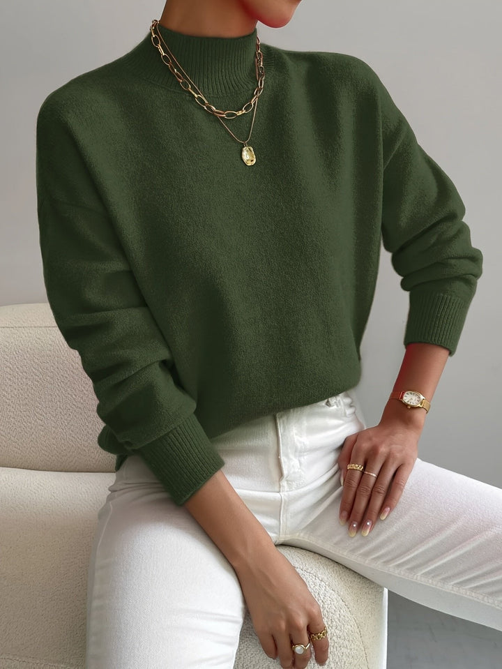 Cozy women's relaxed fit long sleeve mock turtleneck sweater, perfect for comfortable autumn and winter days.