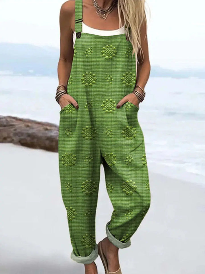 Comfortable women's patterned wide-leg jumpsuit with adjustable straps and practical pockets for everyday style.