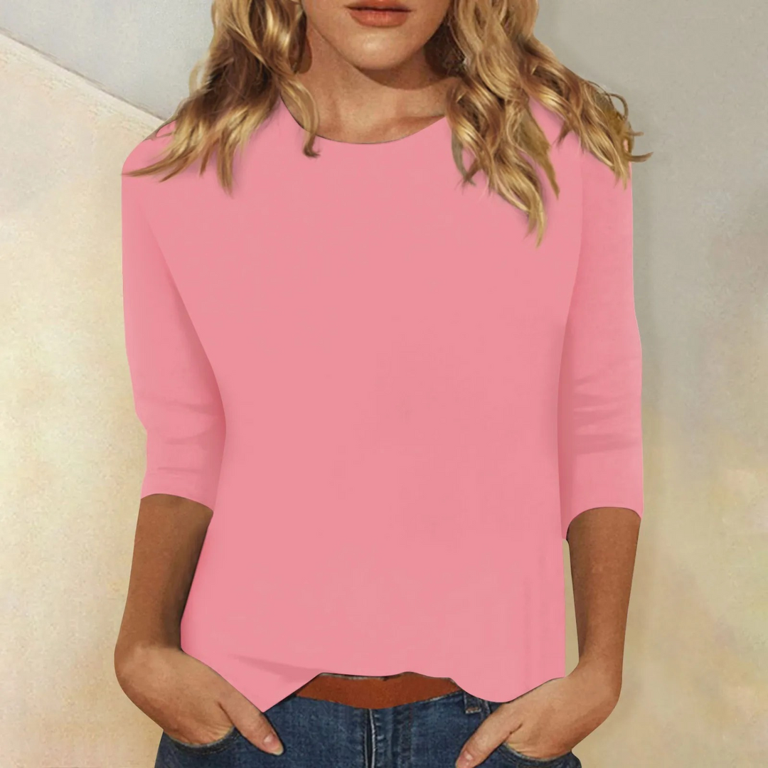 Women's relaxed fit round neck 3/4 sleeve top. Comfortable casual everyday style for versatile wear.