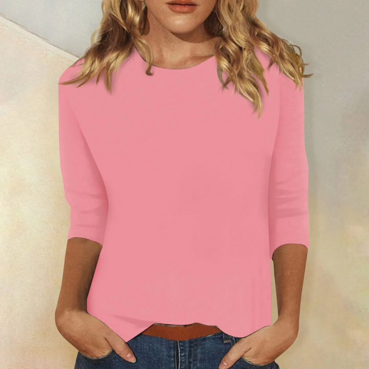 Women's relaxed fit round neck 3/4 sleeve top. Comfortable casual everyday style for versatile wear.