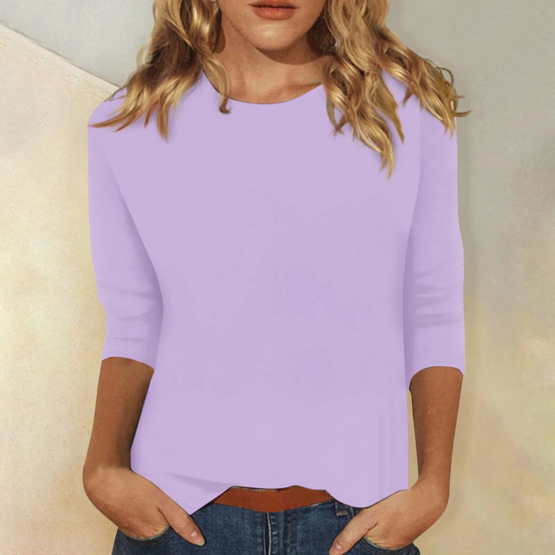 White women's casual round neck top with 3/4 sleeves. Versatile relaxed fit for effortless everyday style.