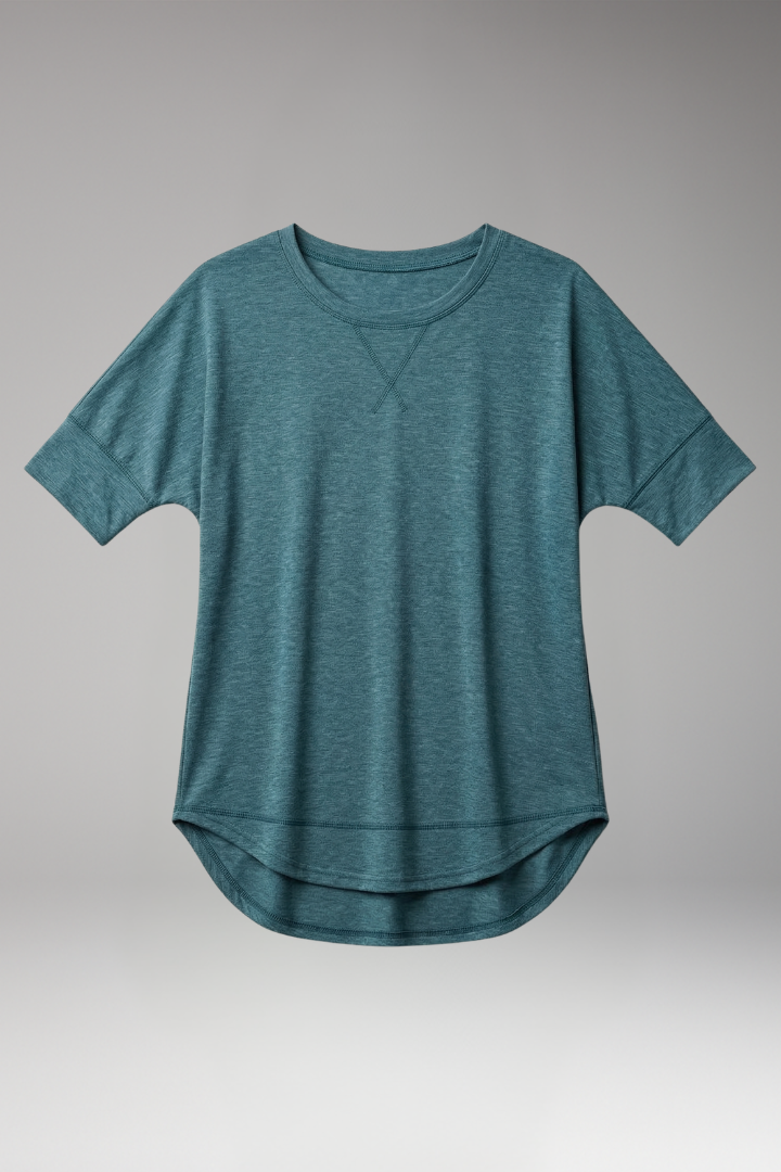 Comfortable women's short sleeve tee featuring a relaxed fit and flattering curved hem. Versatile fashion.