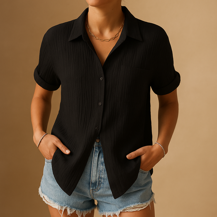 Stylish women's short sleeve button shirt, ideal for summer. This relaxed fit blouse offers versatile wear.