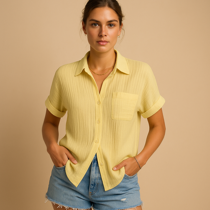 Comfortable women's relaxed fit short sleeve button shirt. A casual blouse with a button-up front and pocket.